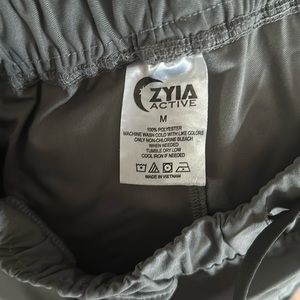 Worn a hand full of times, high rise waist w/ draw string, two cargo pockets.